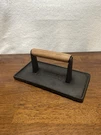 Charcoal Companion Cast Iron Panini Grill Press With Wood Handle 9X4". Fixed Price $19.99.
