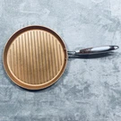 Cooks Essentials 12 Inch Round Copper Coated Cast Iron Grill Pan Strong Handle. Fixed Price $24.95.