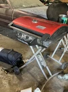 Coleman Nxt 200 Portable Propane 2-BURNER Gas Grill, Red, Wheeled Stand. Fixed Price $50.00.