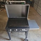 Expert Grill 3-BURNER Propane Griddle Black Steel With Lid And Side Shelf. Fixed Price $90.00.