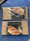 New Sealed Skookum Brand Grilling Plank 2 Pk 7" X 14" +one & Rack. Fixed Price $21.00.