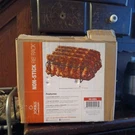 Non-stick Porcelain Coated Steel Roasting Stand Holds 4 Racks Of Ribs. Fixed Price $15.00.