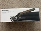 Brookstone Motorized Grill Brush With Steam Cleaning Power. Fixed Price $28.00.