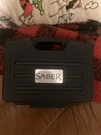 Saber Stainless Steel Rotisserie Kit W/ Case And Motor. Fixed Price $99.00.